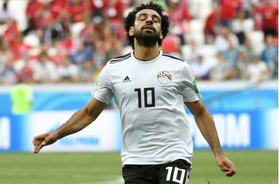 Penyerang tim nasional Mesir Mohamed Salah bereaksi di sela-sela laga pamungkas penyisihan Grup A melawan Arab Saudi di Stadion Volgograd Arena, Volgograd, Rusia, Senin (25/6/2018). (AFP/Philippe DESMAZES)